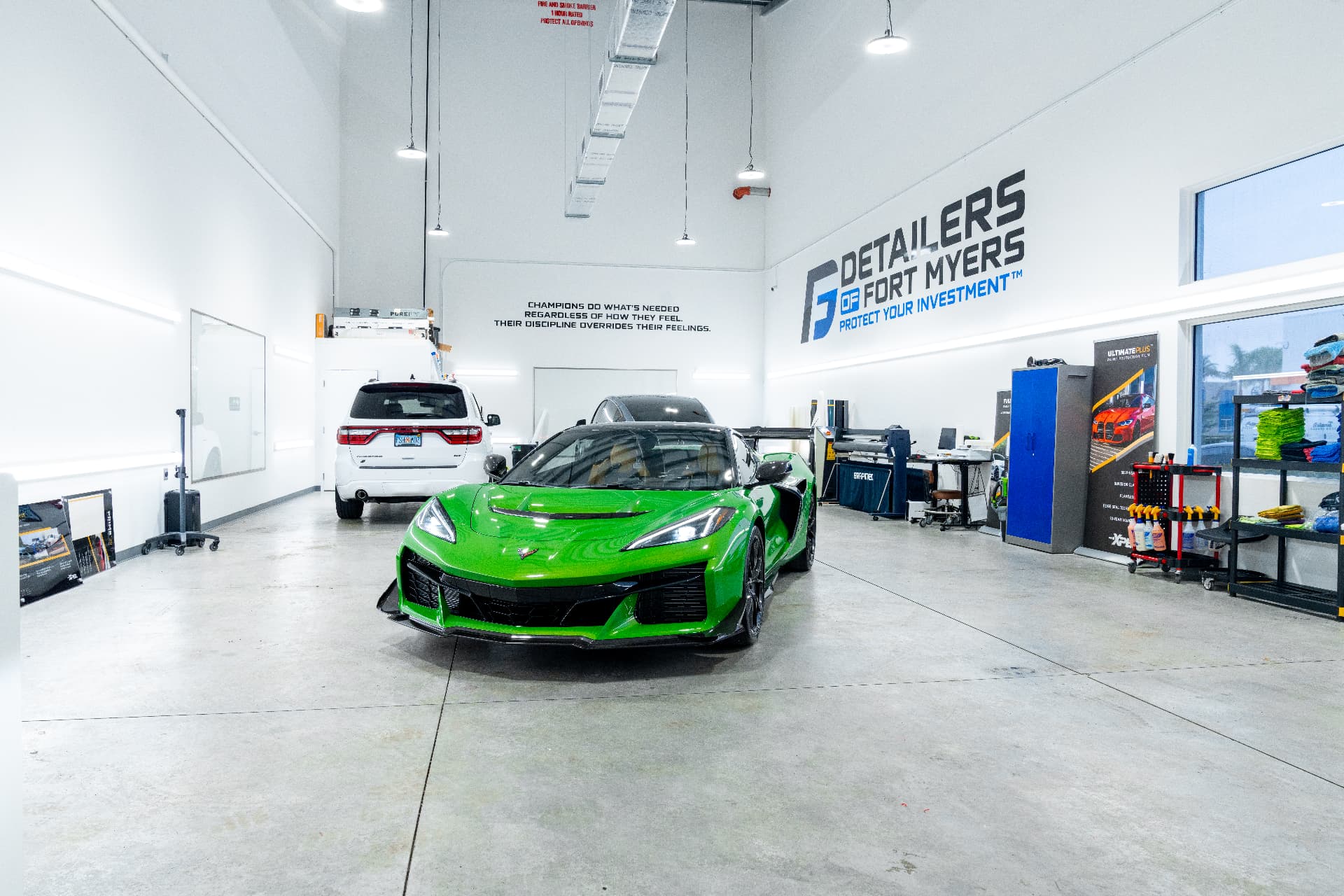 Green Chevrolet Corvette Z06 inside the Detailers of Fort Myers shop after the Essential Three Package