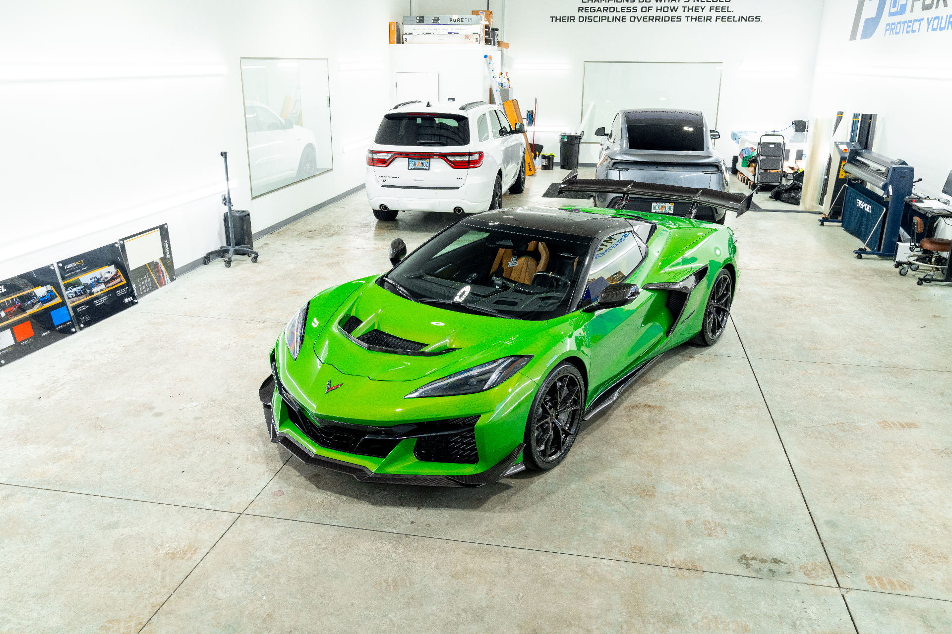 Green Chevrolet Corvette Z06 inside the Detailers of Fort Myers install bay